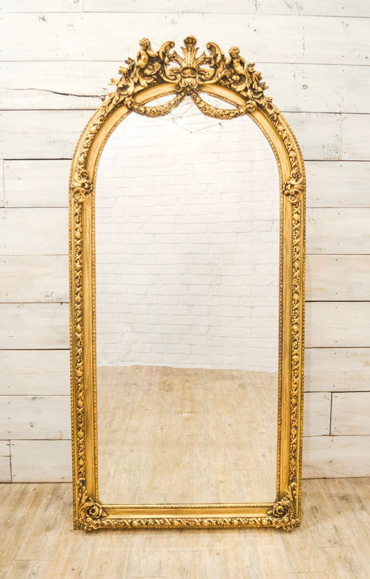 Putti Crowned Gilt Framed Beveled Mirror